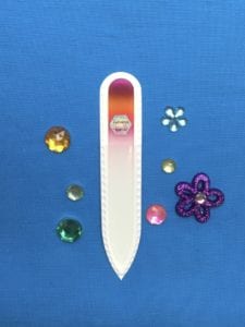 Fizzle Stick Small Glass Nail File.  This file will effectively yet gently file and shape your nails without leaving rough edges. It seals the nail tip as it files helping to prevent cracking and chipping.
